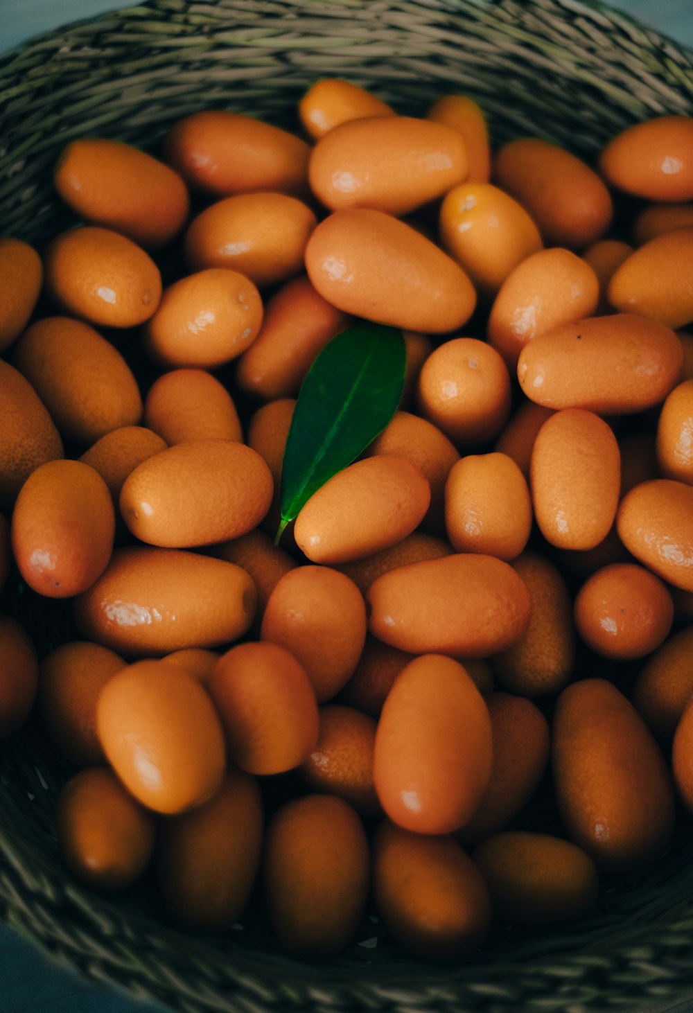 a basket filled with lots of brown eggs