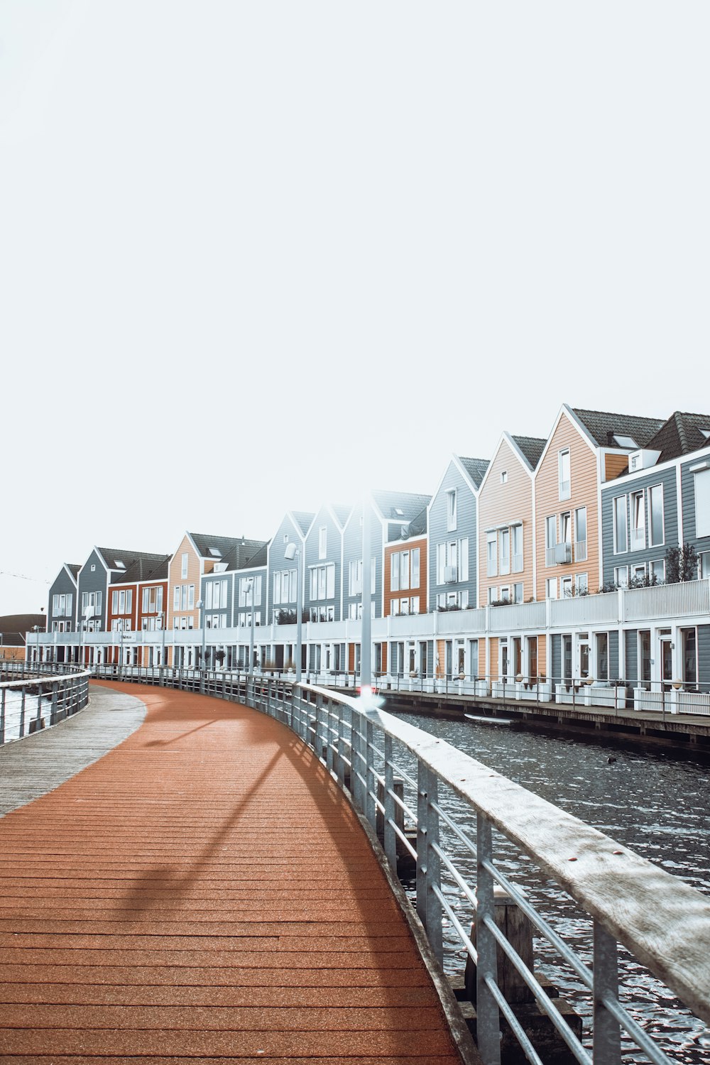 a row of houses next to a body of water