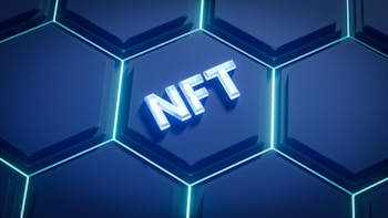 A digital graphic featuring a series of glowing hexagons with a modern, sleek design. In the center, the acronym 'NFT' is prominently displayed, illuminated in a 3D style.