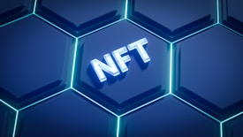 A digital graphic featuring a series of glowing hexagons with a modern, sleek design. In the center, the acronym 'NFT' is prominently displayed, illuminated in a 3D style.