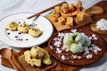 Traditional delights and healthy snacks arranged invitingly on a rustic platter