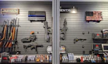 a display of guns and guns in a gun shop