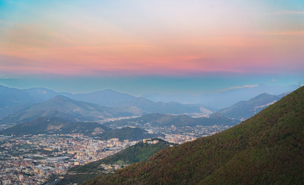 a view of a city from the top of a hill