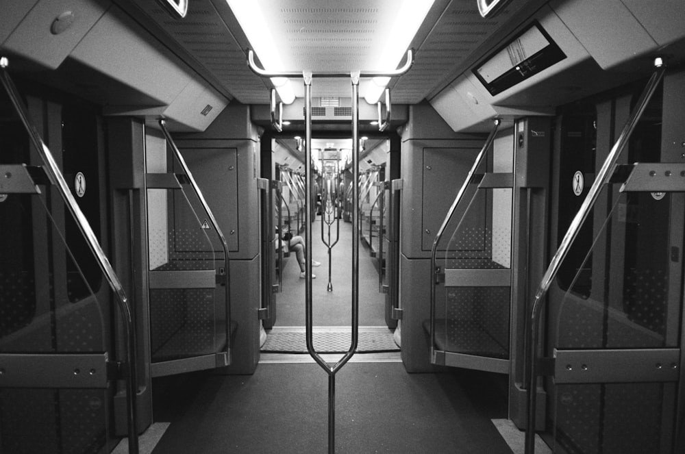 a black and white photo of a subway car