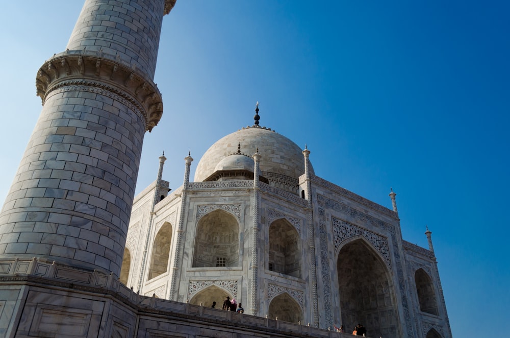 a large white building with two towers on top of it