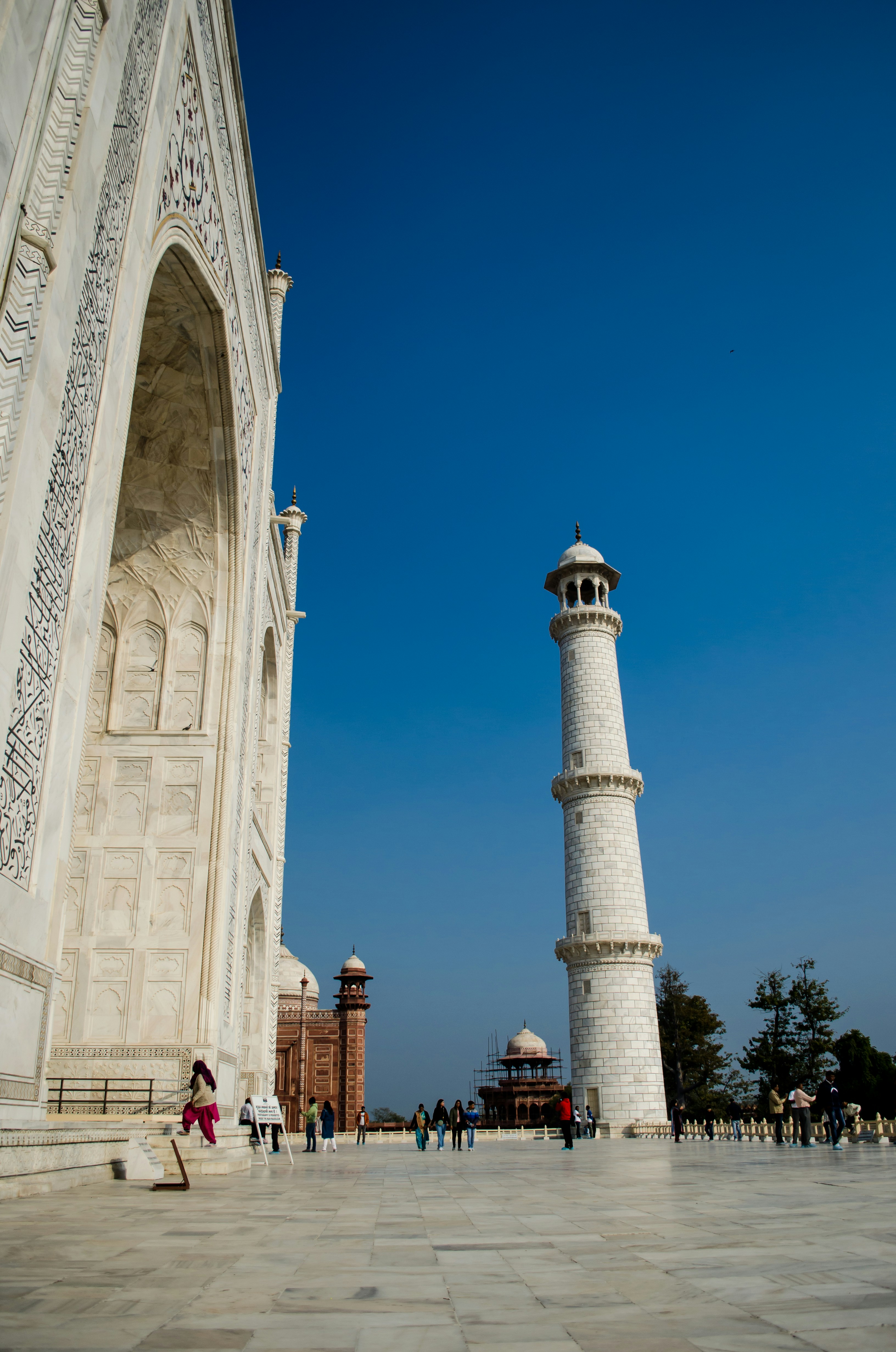 a tall white tower sitting next to a tall white building