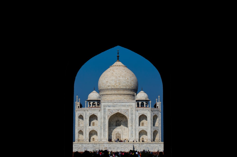 a large white building with a dome on top of it