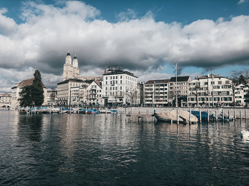 a body of water with a bunch of buildings in the background