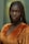 a woman with braids standing in a room