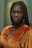 a woman with braids standing in a room