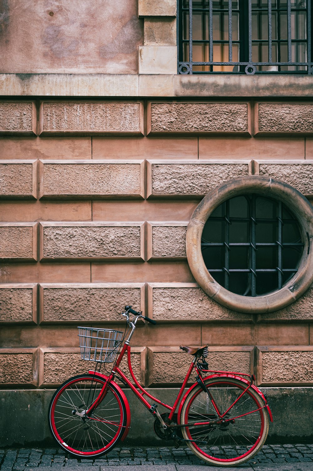 a bicycle parked on the side of a building