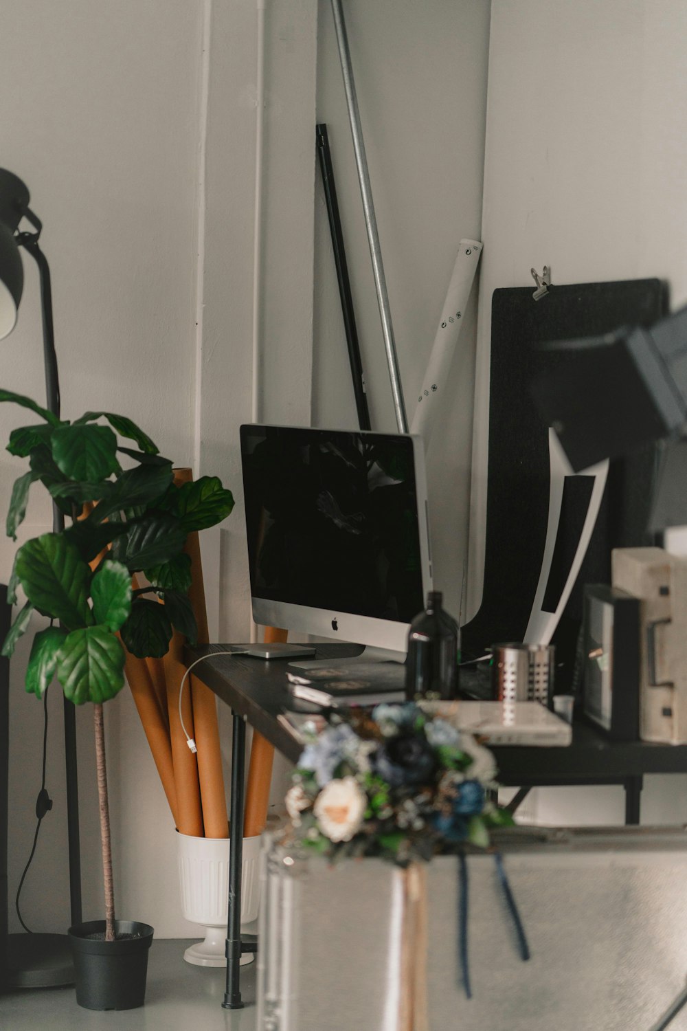 a desk with a computer monitor and a keyboard