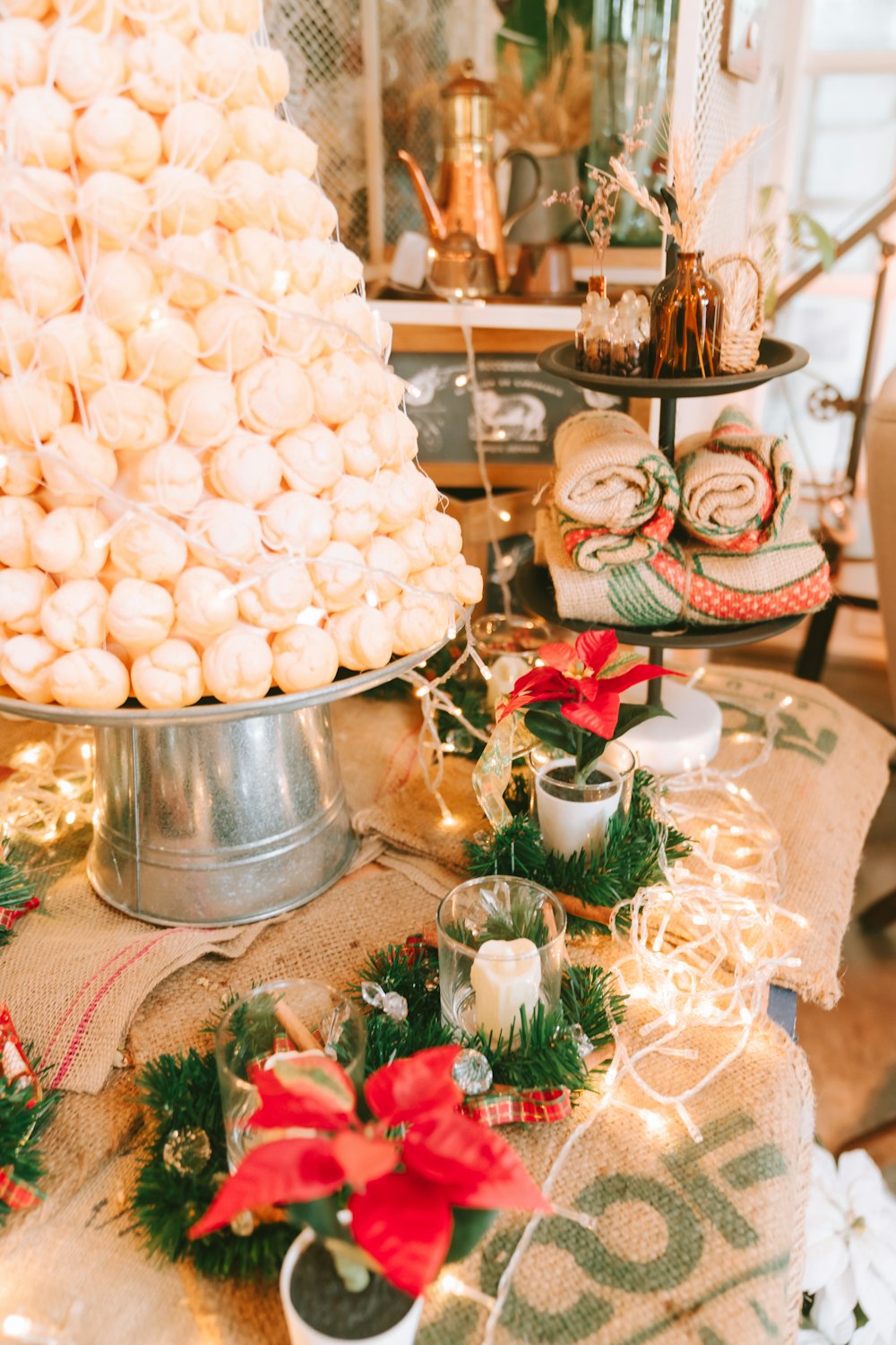 a table topped with a cake covered in white frosting