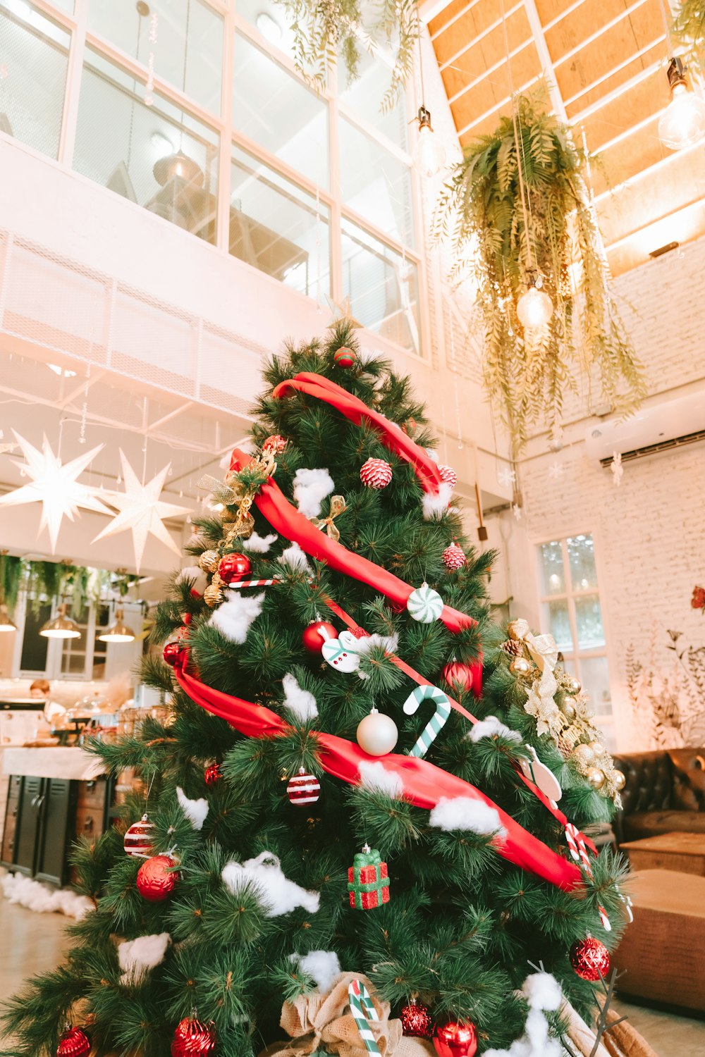 a decorated christmas tree in a large room