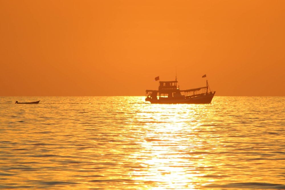 a small boat in the middle of a large body of water