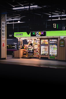 a gas station with a lit up gas station sign
