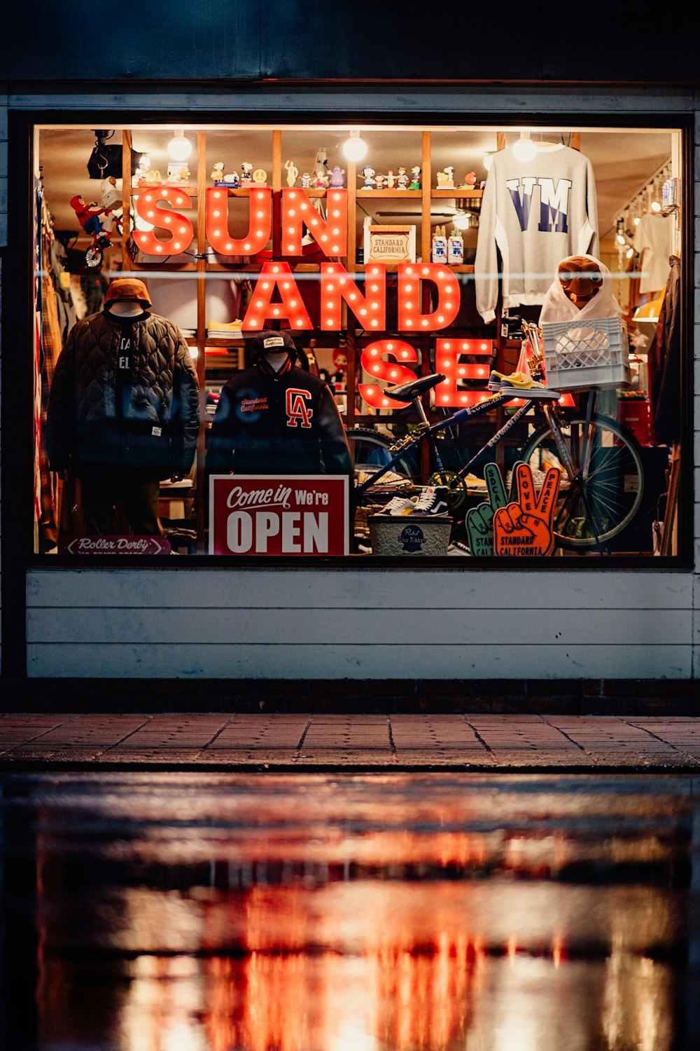 a store window with a reflection of a man on the street