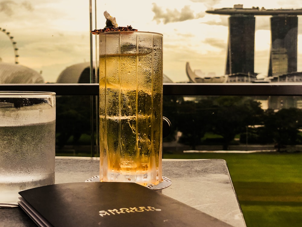 a book and a glass of water on a table