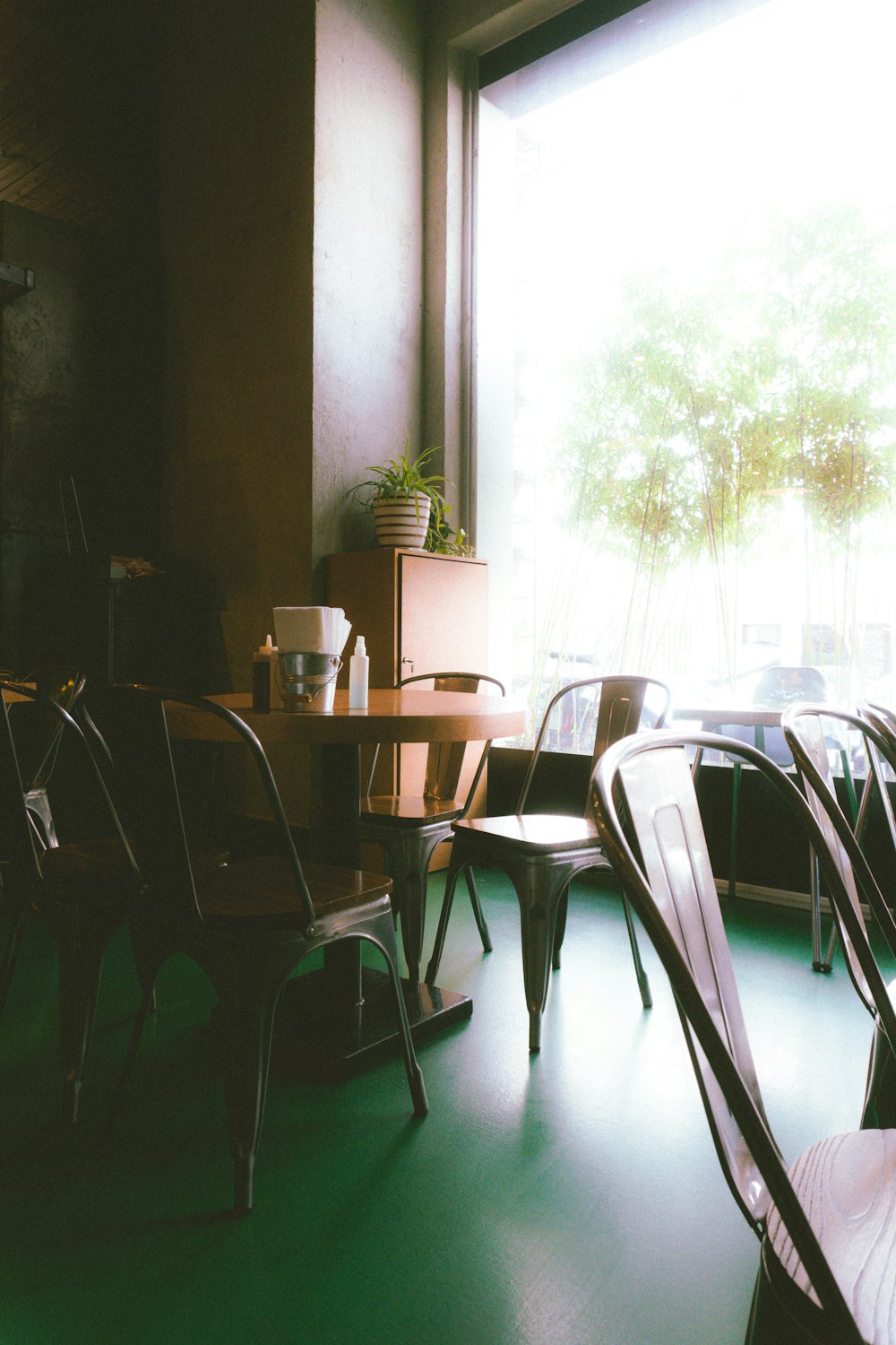 a room filled with lots of chairs and a table