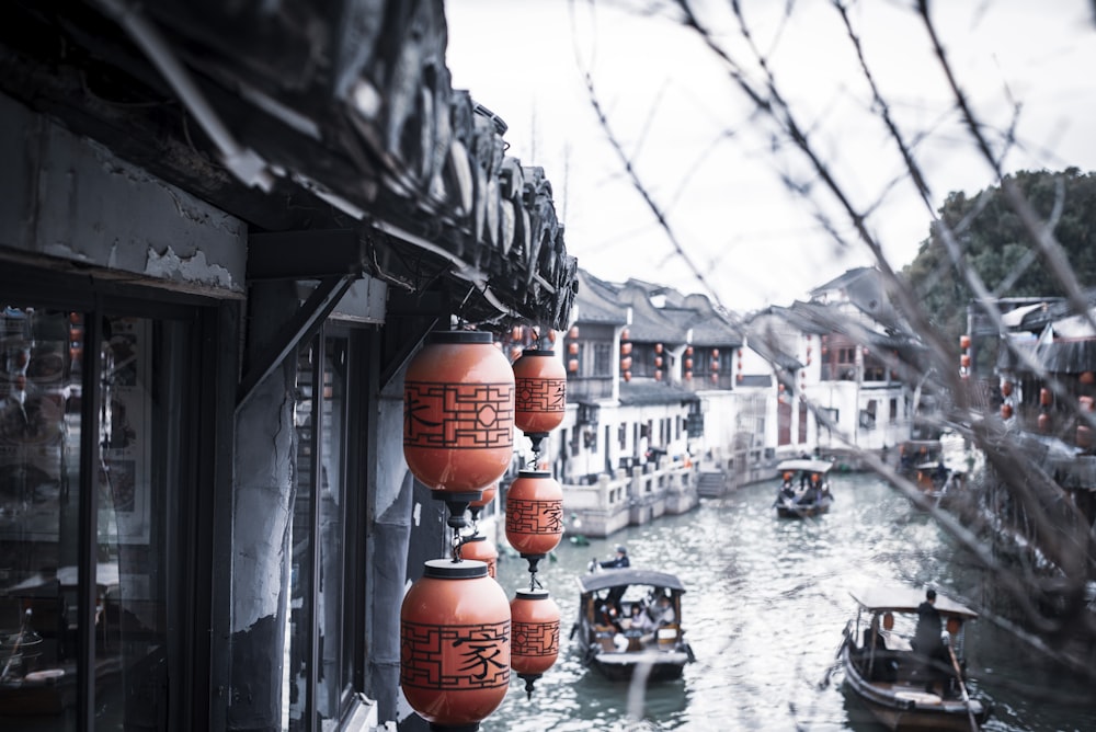 a waterway with boats and buildings in the background