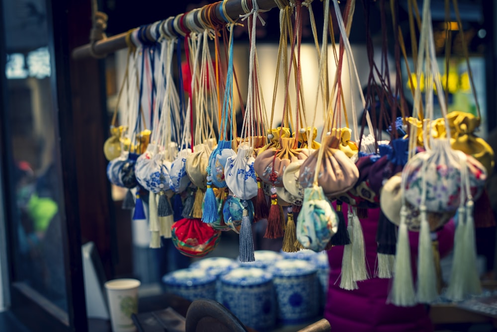 a bunch of bags hanging from a rack