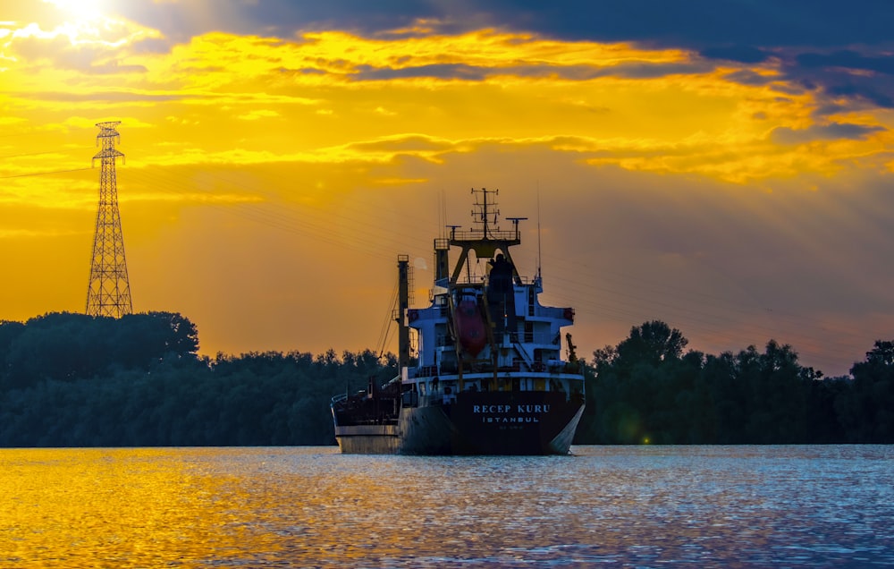 a large boat floating on top of a body of water