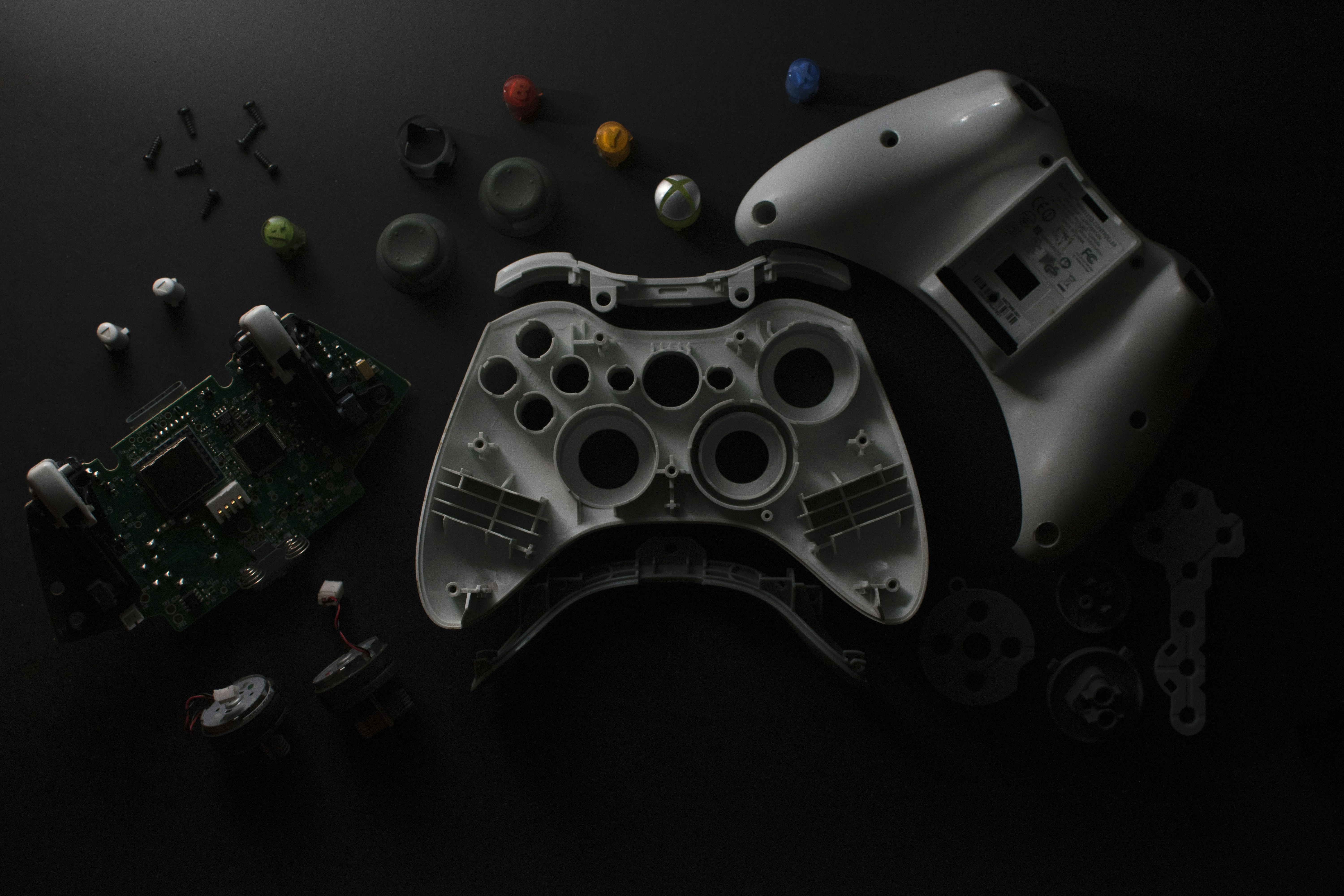 a video game controller sitting on top of a table, 