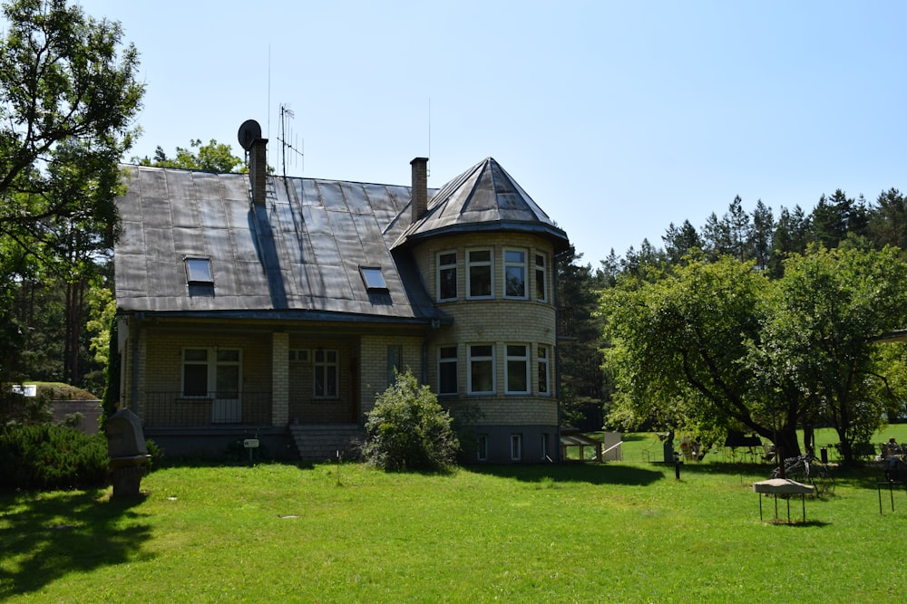 a large house with a large lawn in front of it
