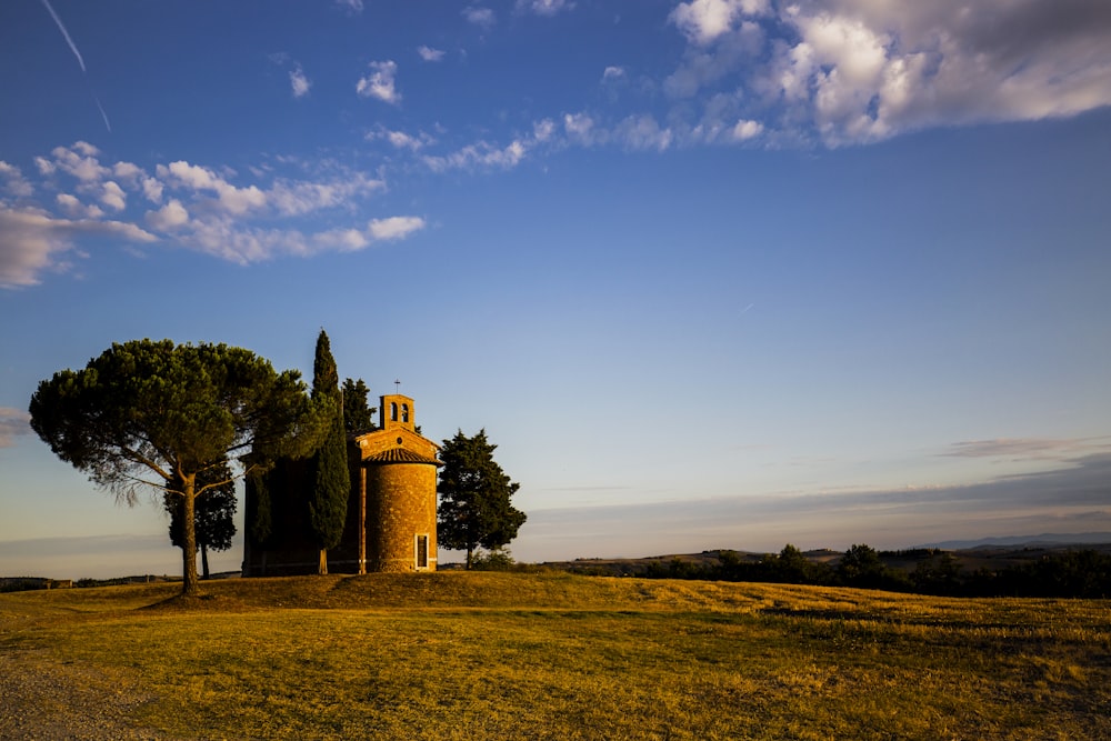 a large tower sitting on top of a lush green field