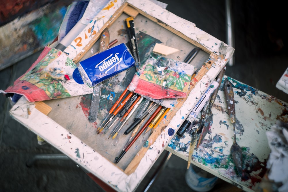 a box filled with lots of art supplies