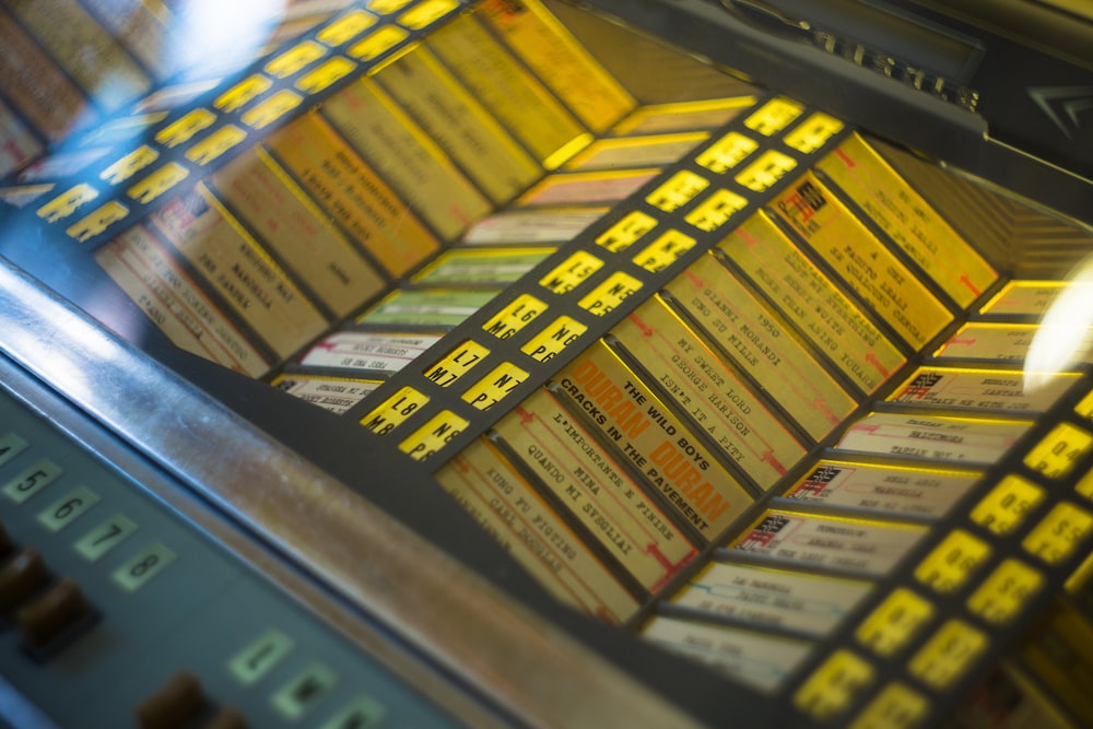 a close up of a machine with a lot of tickets on it