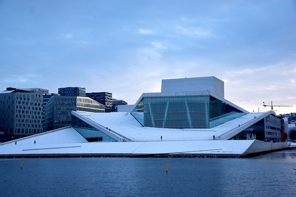 a large building sitting next to a body of water