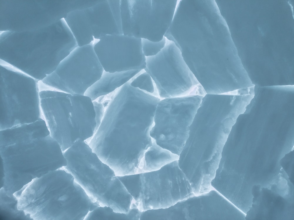 a close up view of ice cubes in the snow