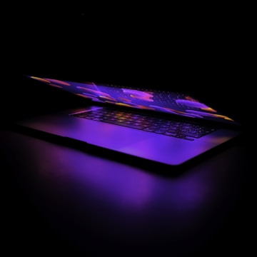 a laptop computer sitting on top of a table