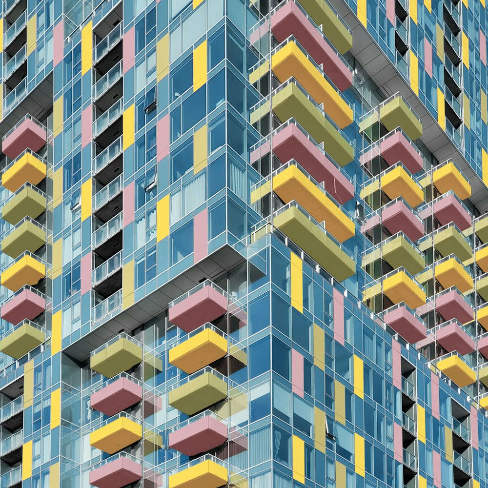 a multi - colored building with balconies and balconies
