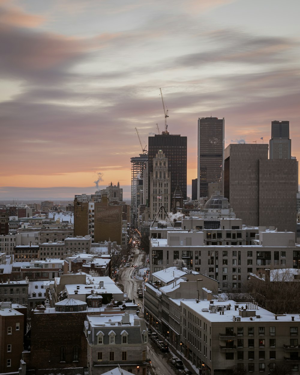 a view of a city with tall buildings in the background