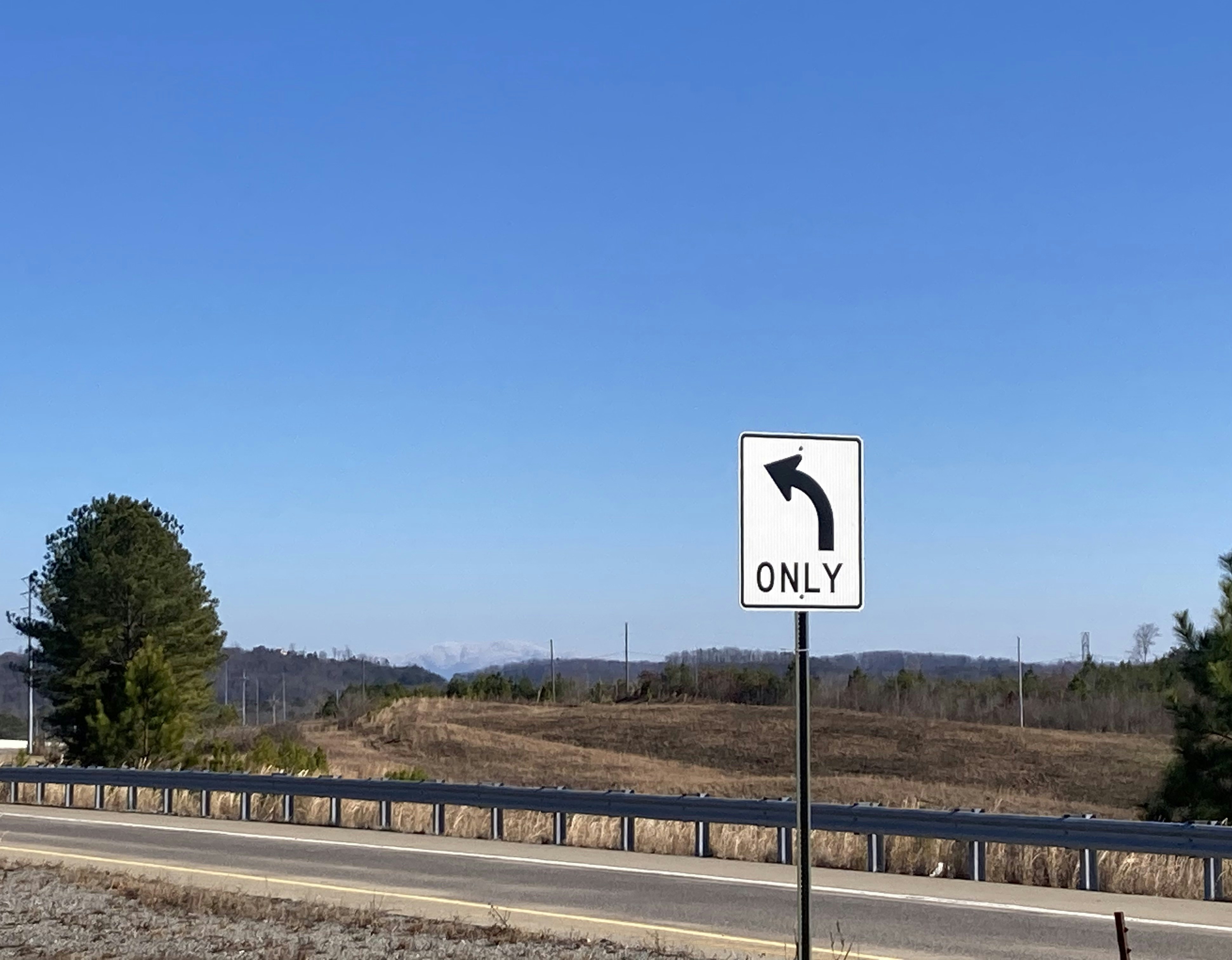 a street sign on the side of a road