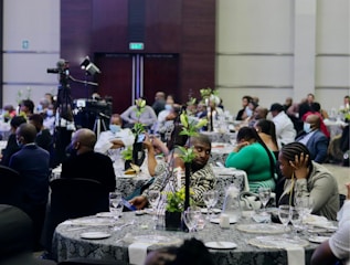 a group of people sitting around a table
