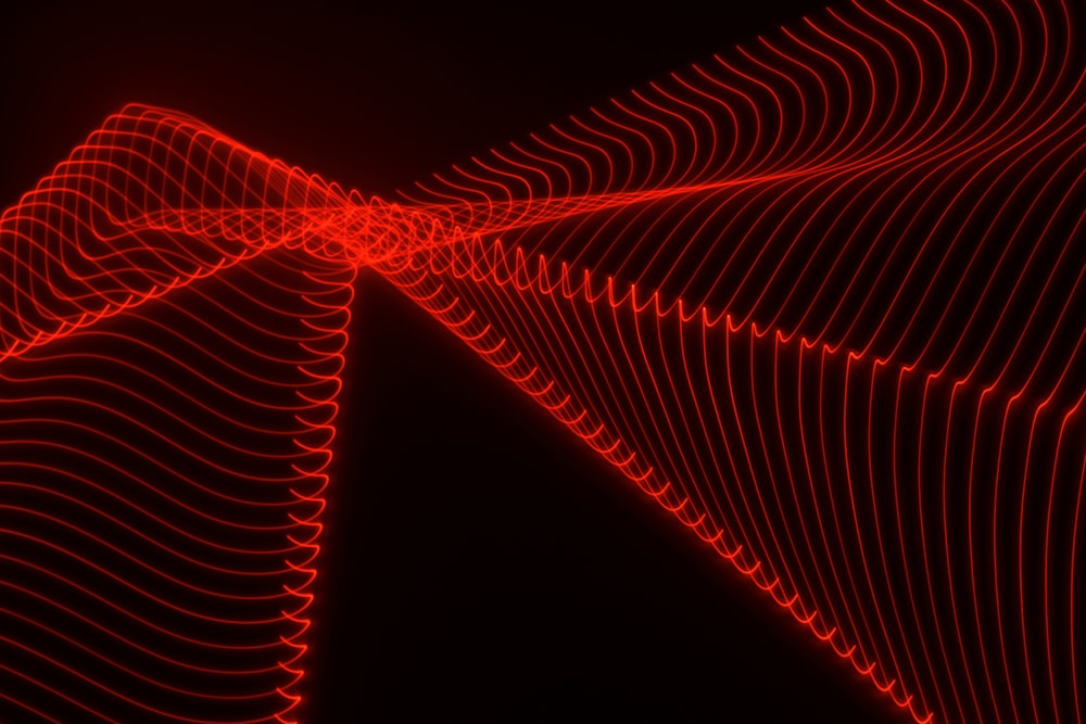 an abstract red and black background with wavy lines