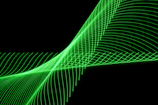 A soundwave visualization on a computer screen with a greenish hue.