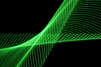 Animated waveforms representing radio signals pulsing in green and amber on a dark background.