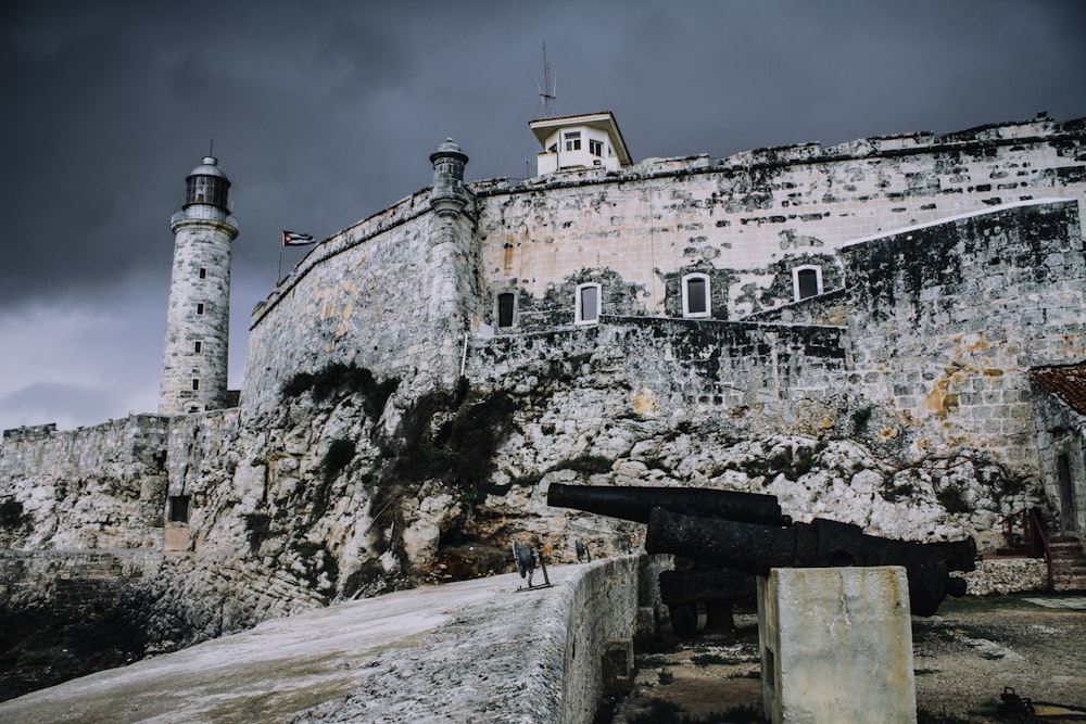 a stone castle with two towers on top of it