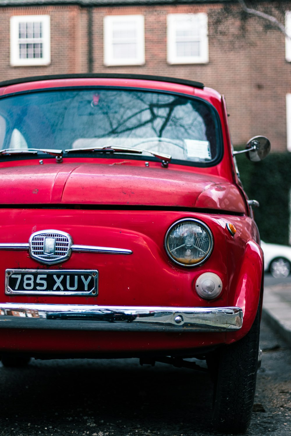 a red car parked on the side of the road