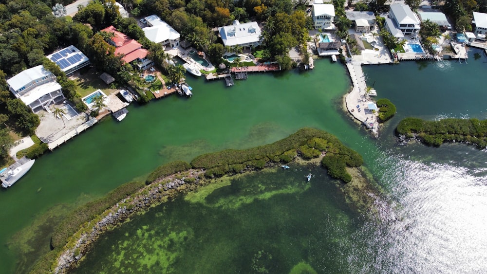 an aerial view of a body of water surrounded by houses