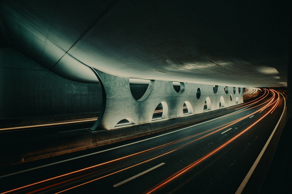 a long exposure shot of a highway at night