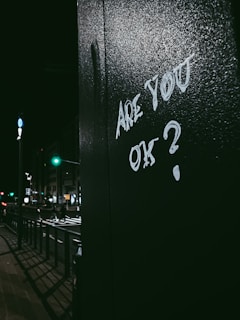 graffiti on the side of a building that says are you ok?