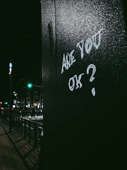 graffiti on the side of a building that says are you ok?