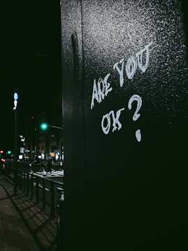 graffiti on the side of a building that says are you ok?