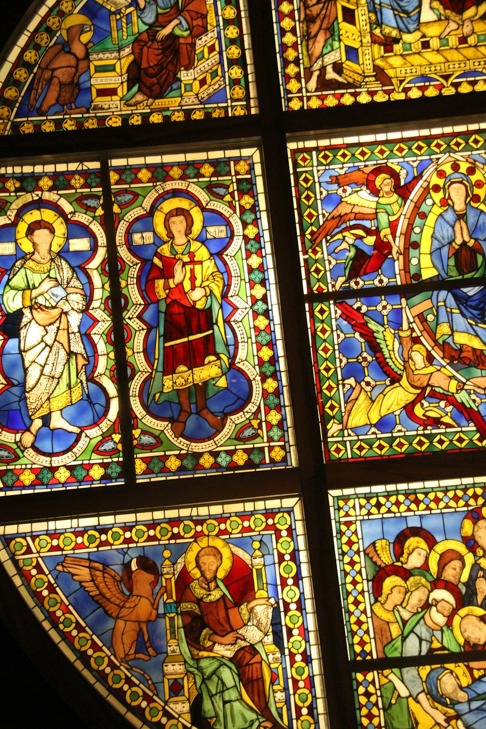 a stained glass window depicting the birth of jesus