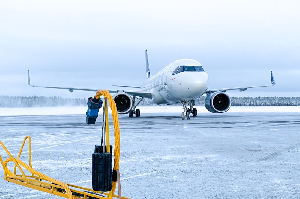 a large jetliner sitting on top of an airport tarmac